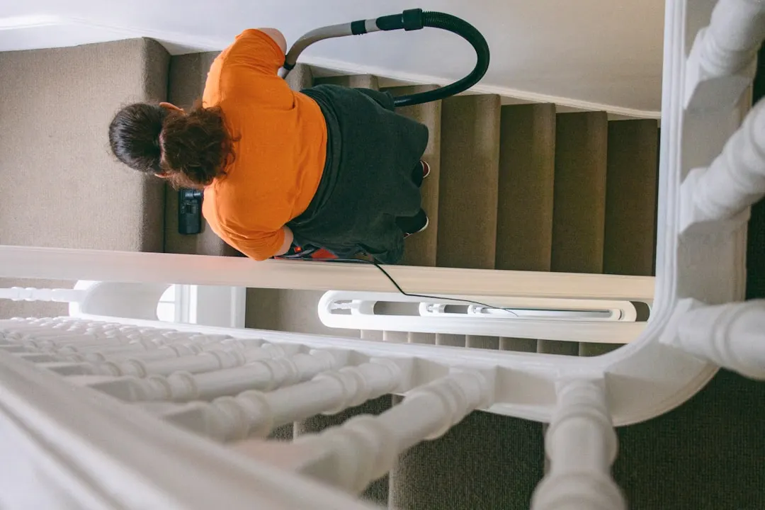 Duct cleaning technician with HEPA vacuum in Calgary