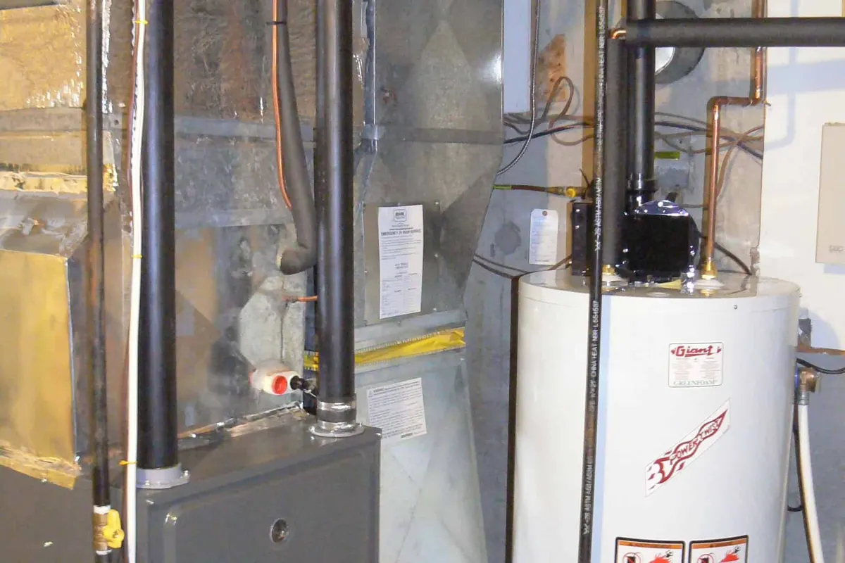 New high-efficiency gas furnace installed in a Calgary basement mechanical room