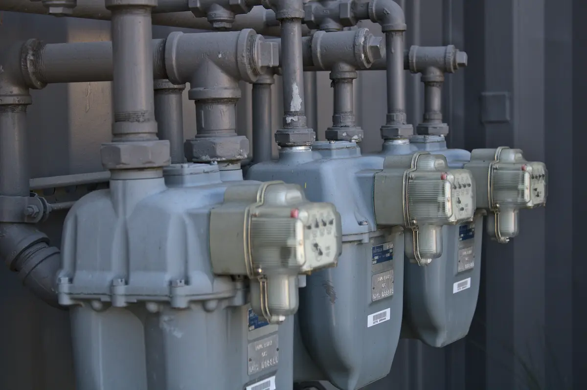 Pool heater installation with gas piping in a Calgary backyard