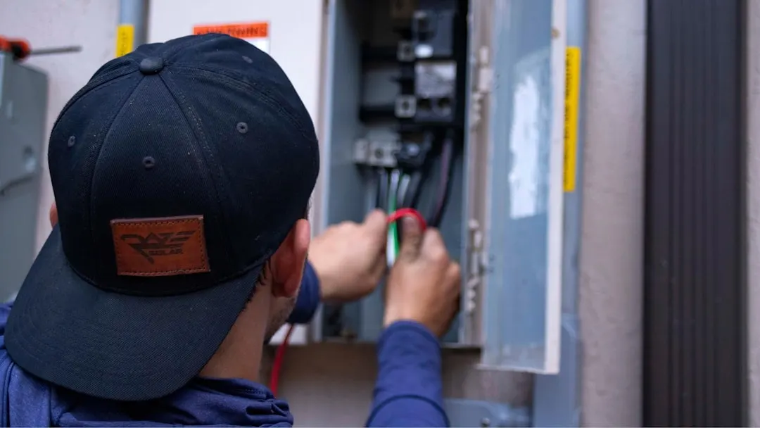 Calgary Heating and Cooling technician installing a high-efficiency furnace