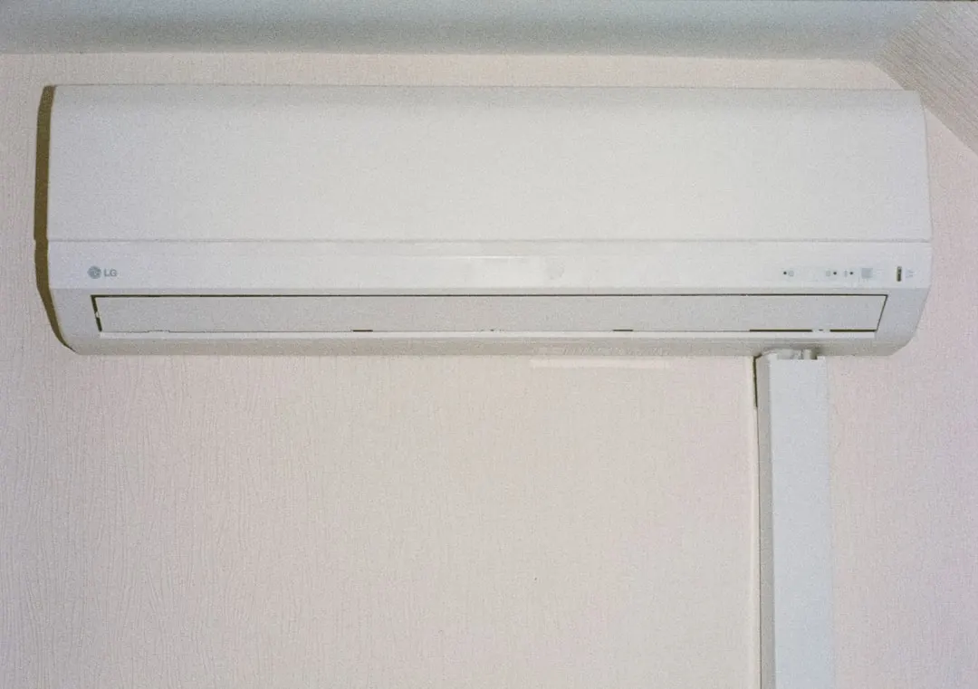 Wall-mounted ductless mini-split indoor unit in a Calgary living room