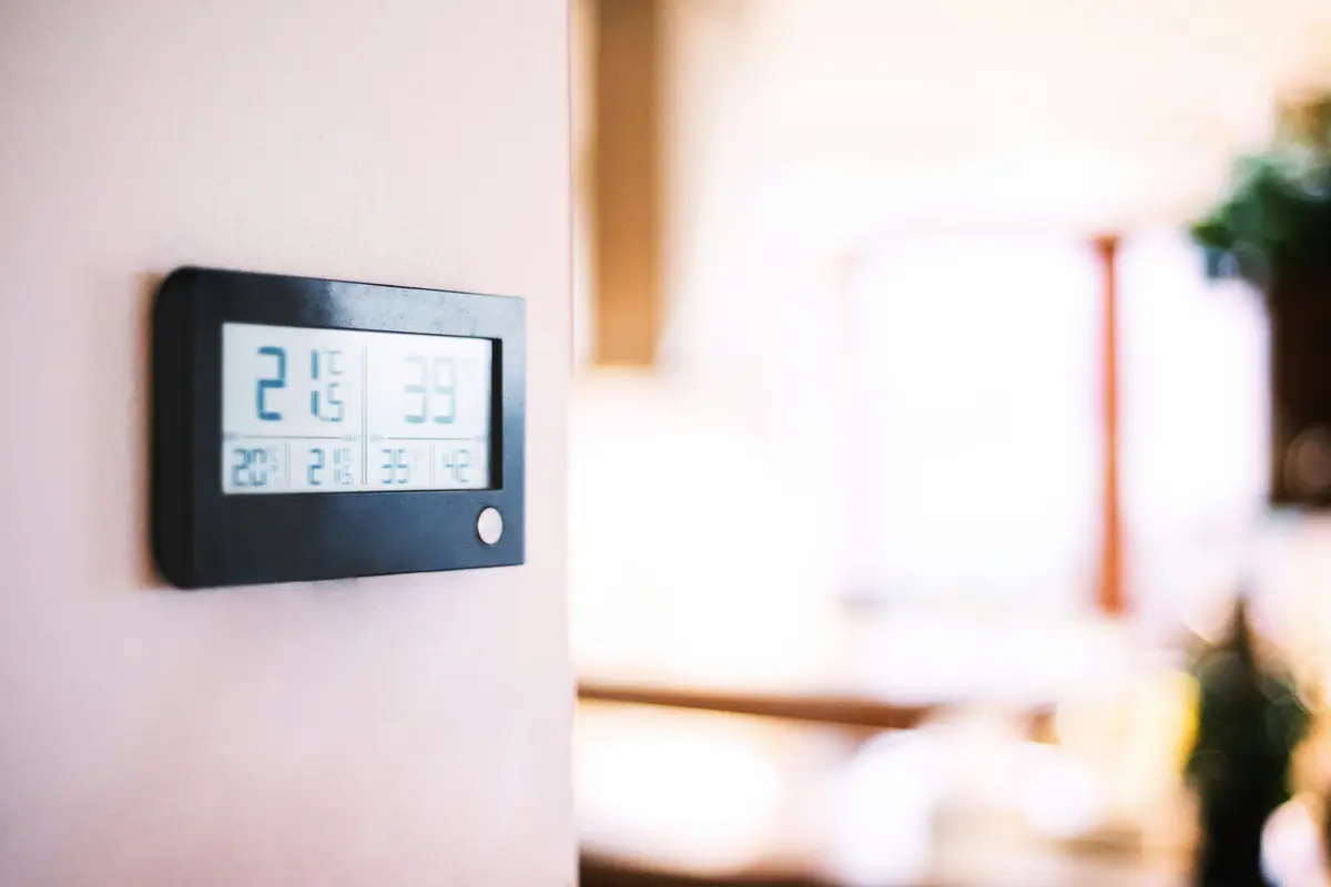 Modern smart thermostat on a residential wall in Calgary